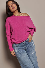 Model Tahnee wearing size 10 of the Snuggle Up Jumper in colour Magenta (Pink), from the front, cropped image