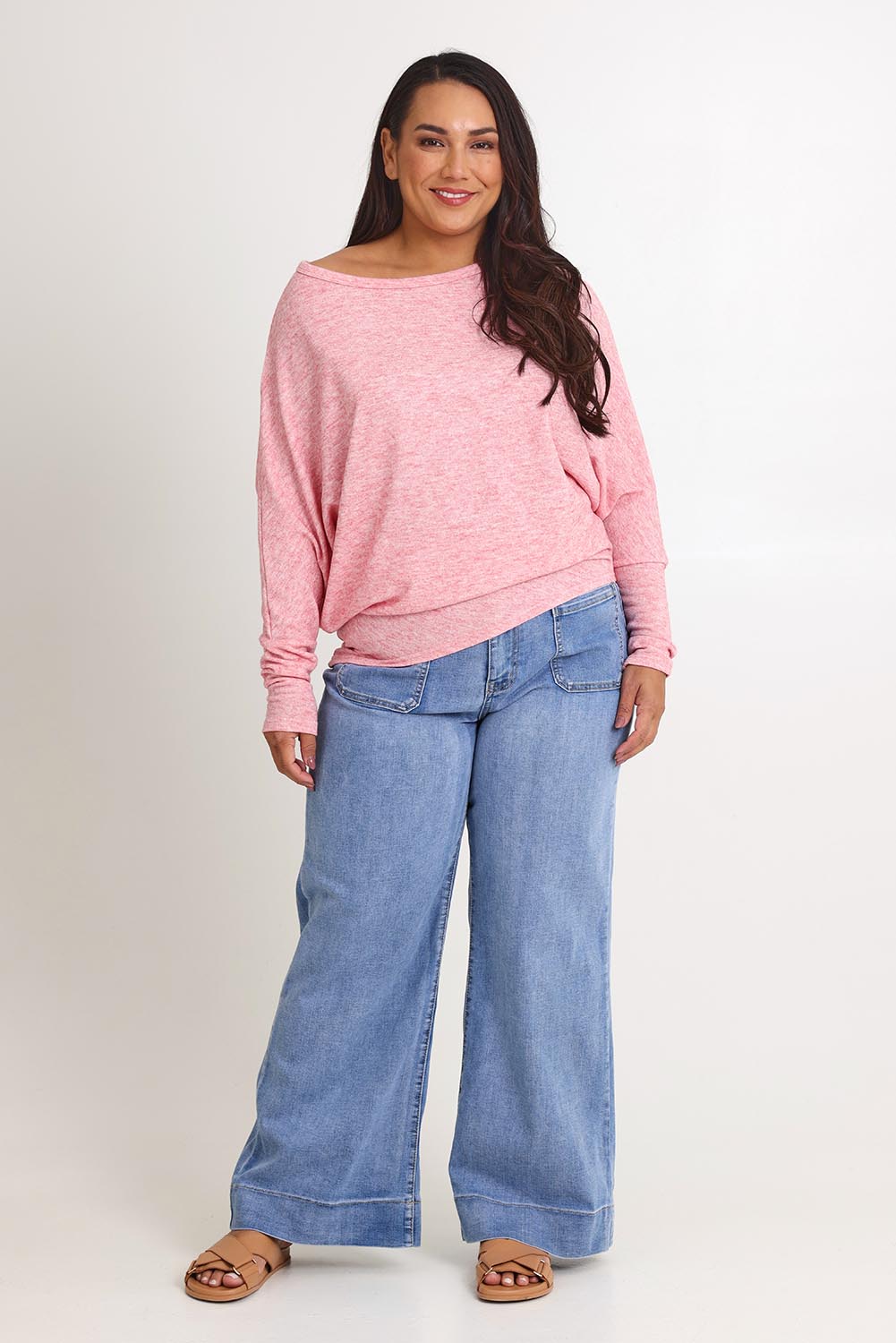 Model Ashleigh wearing size 16 of the Snuggle Up Jumper in colour Pinkmarl (Pink), from the front, showing the whole outfit