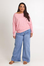Model Ashleigh wearing size 16 of the Snuggle Up Jumper in colour Pinkmarl (Pink), from the front, showing the whole outfit
