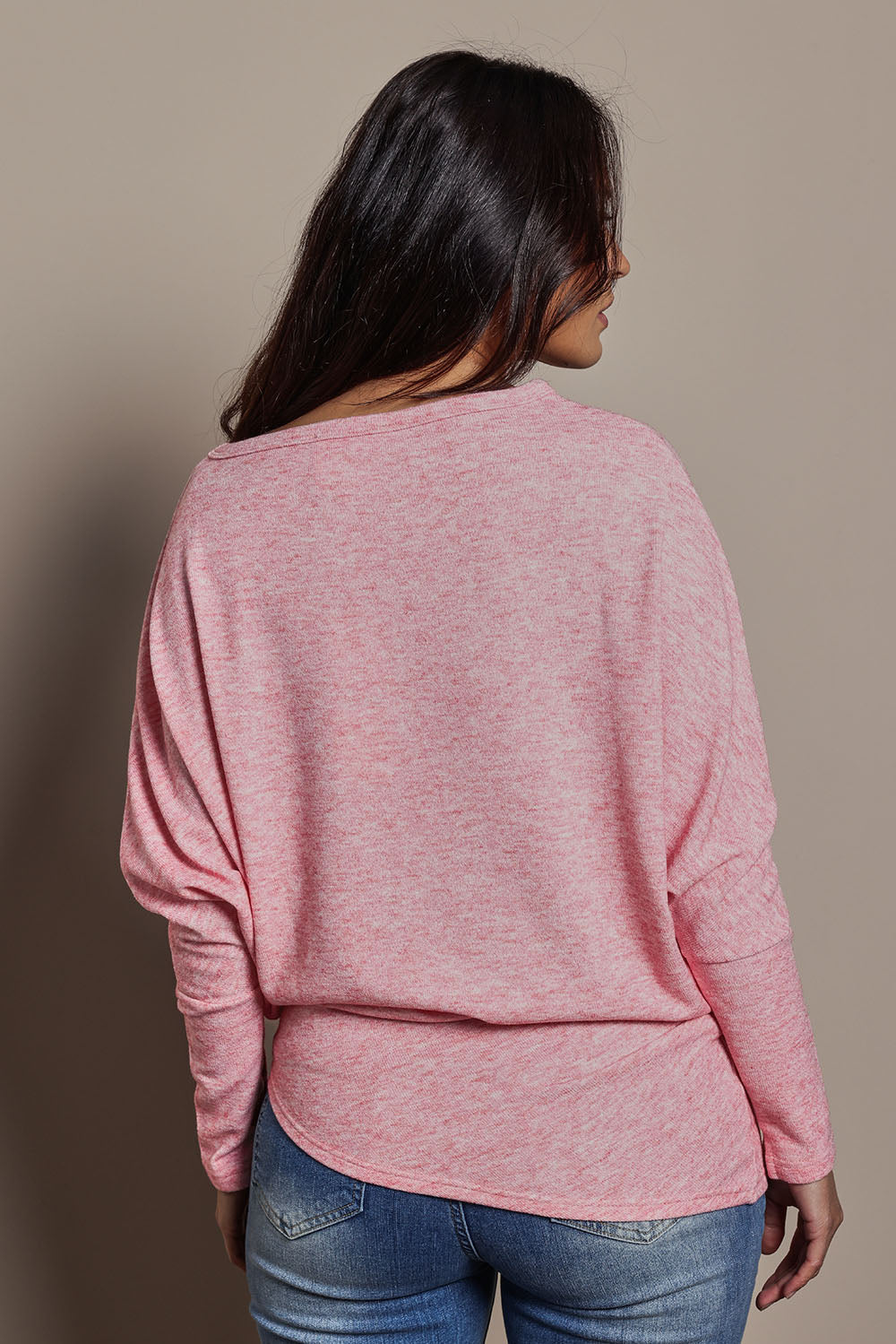 Model Tahnee wearing size 10 of the Snuggle Up Jumper in colour Pinkmarl (Pink), from the back
