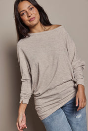 Model Tahnee wearing size 10 of the Snuggle Up Jumper in colour Sandmarl, from the front, cropped image