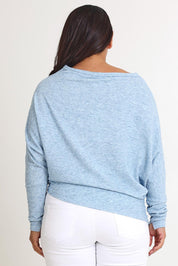 Model Ashleigh wearing size 16 of the Snuggle Up Jumper in colour Skymarl (Blue), from the back