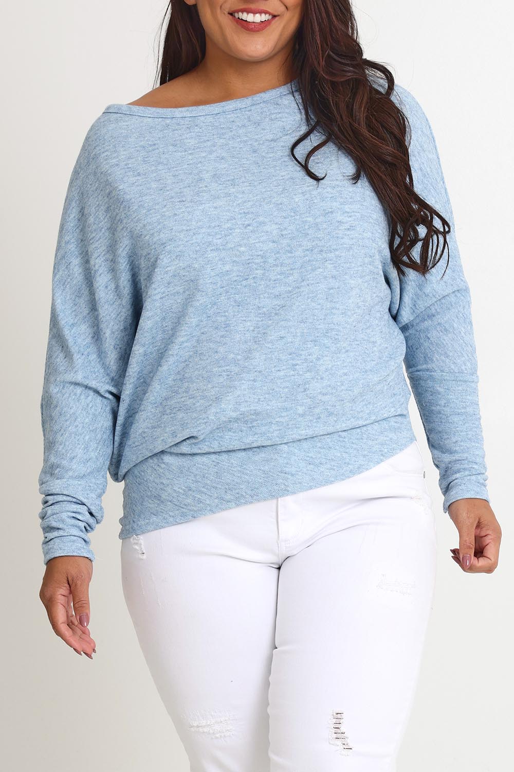 Model Ashleigh wearing size 16 of the Snuggle Up Jumper in colour Skymarl (Blue), from the front, cropped image