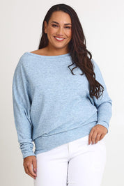 Model Ashleigh wearing size 16 of the Snuggle Up Jumper in colour Skymarl (Blue), from the front, cropped image