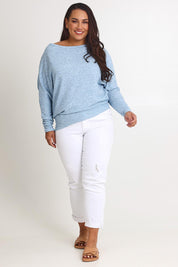 Model Ashleigh wearing size 16 of the Snuggle Up Jumper in colour Skymarl (Blue), from the front, showing the whole outfit