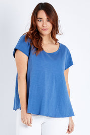 Model Laura wearing size 14 of the Casual Friday Tee in colour Chambray (Blue), from the front, cropped image