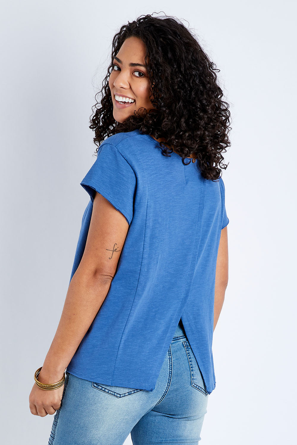 Model Pamela wearing size 10 of the Casual Friday Tee in colour Chambray (Blue), from the front, cropped image