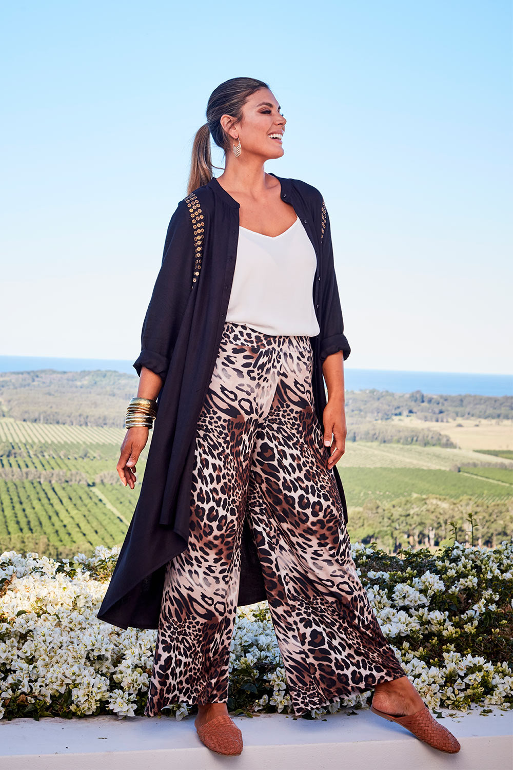Model Palatina wearing size 14 of the You At My Shoulder Tunic in colour Black (Black), from the front, showing the whole outfit