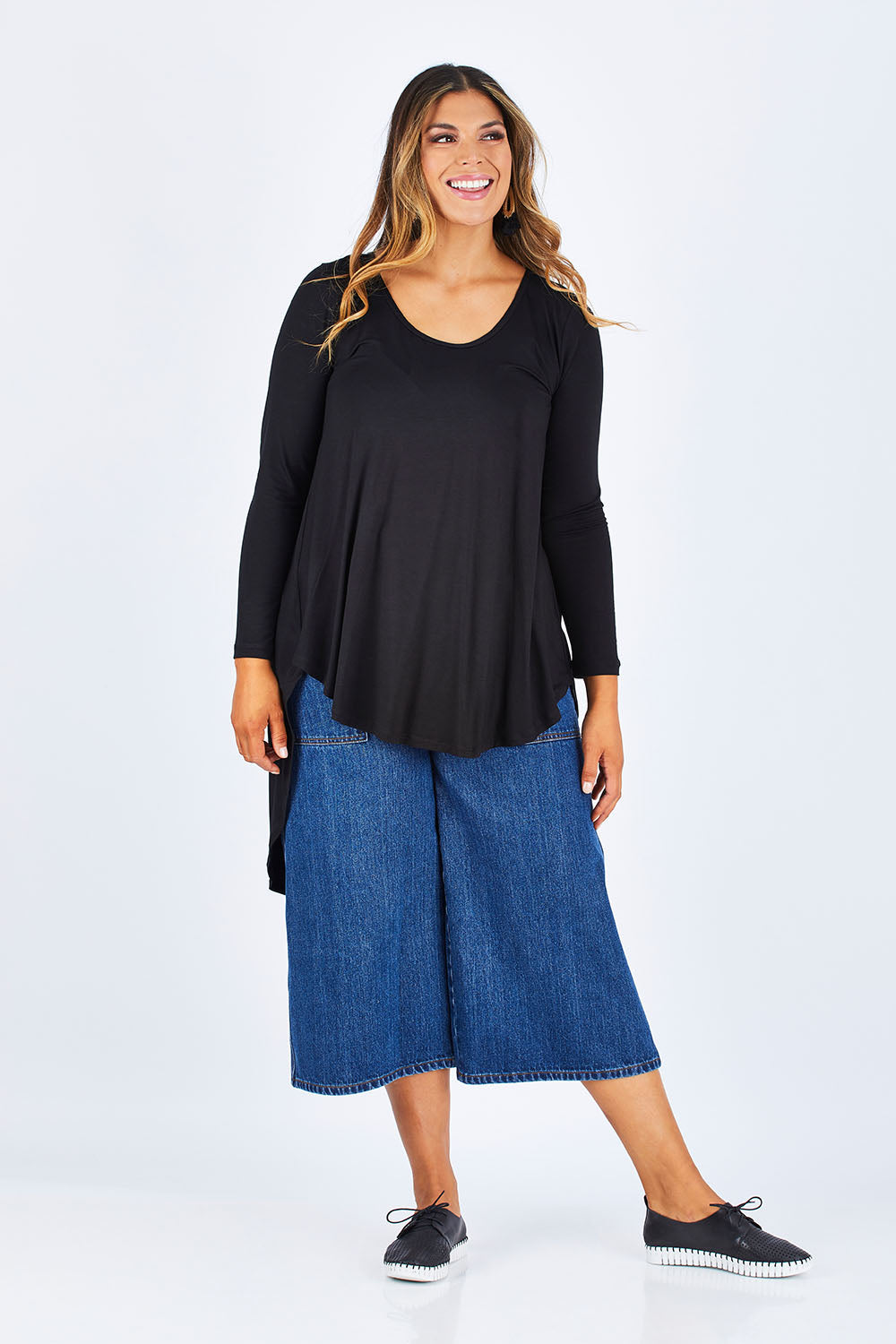 Model Palatina wearing size 14 of the Moonlight Kisses Bamboo Tee in colour Black (Black), from the front, showing the whole outfit