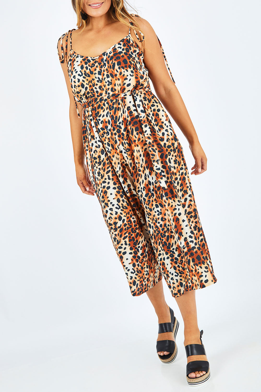 Model Palatina wearing size 14 of the Oh The Places You Will Go Jumpsuit in colour Leopard, from the front, cropped image