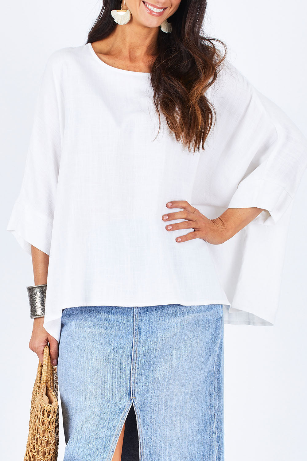 Model Gemma wearing size 10 of the Flow With Me Slouch Top in colour White (White), from the front, cropped image