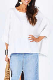 Model Gemma wearing size 10 of the Flow With Me Slouch Top in colour White (White), from the front, cropped image
