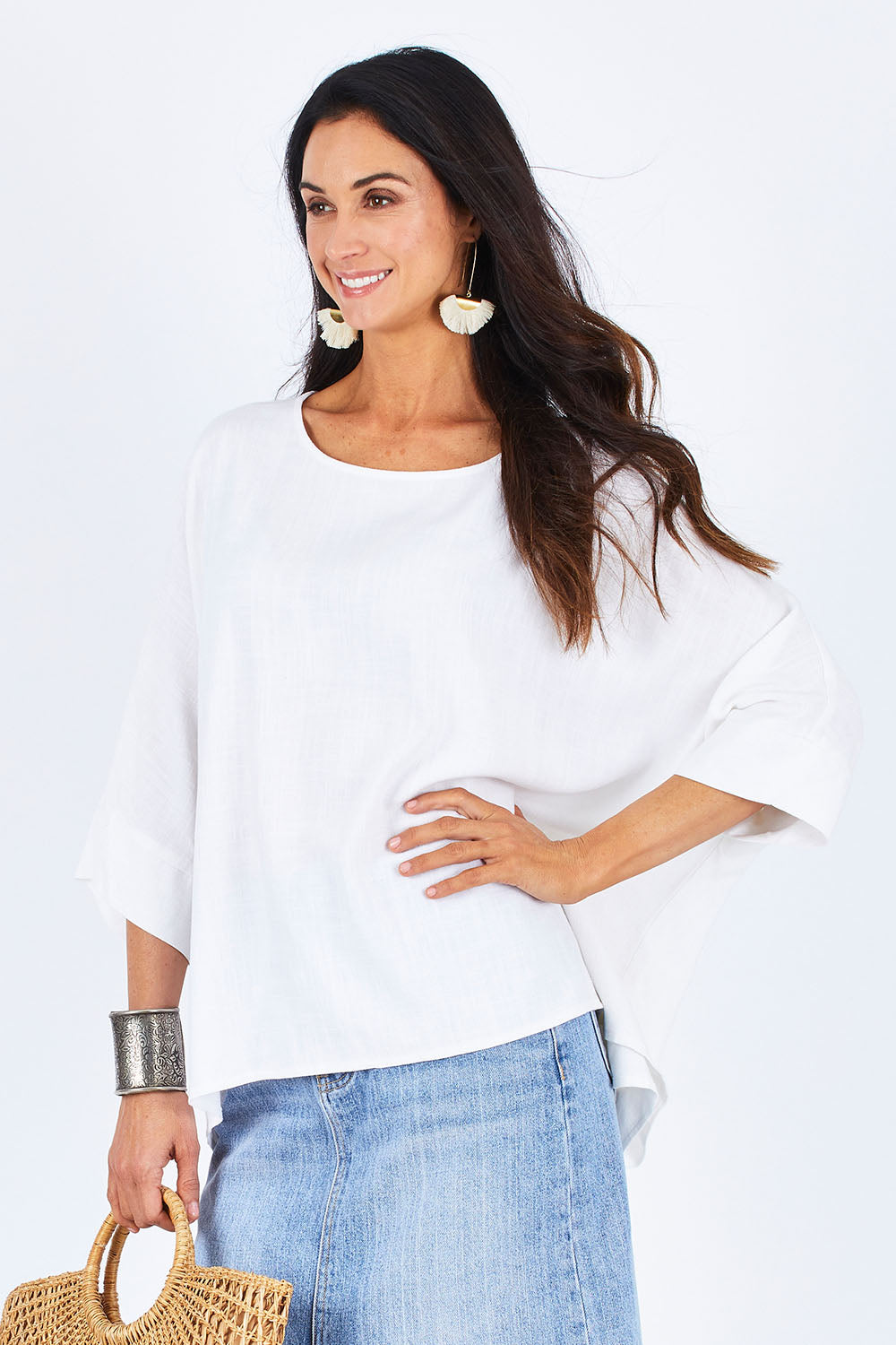Model Gemma wearing size 10 of the Flow With Me Slouch Top in colour White (White), from the front, cropped image