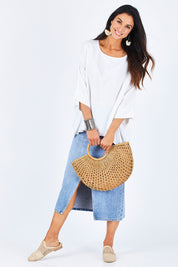 Model Gemma wearing size 10 of the Flow With Me Slouch Top in colour White (White), from the front, showing the whole outfit