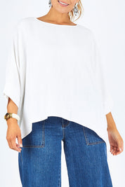 Model Palatina wearing size 14 of the Flow With Me Slouch Top in colour White (White), from the front, cropped image