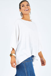 Model Palatina wearing size 14 of the Flow With Me Slouch Top in colour White (White), from the front, cropped image