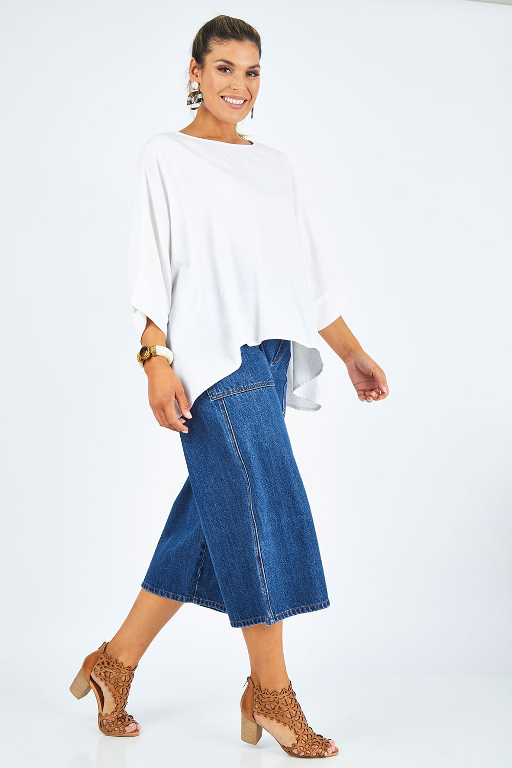 Model Palatina wearing size 14 of the Flow With Me Slouch Top in colour White (White), from the front, showing the whole outfit