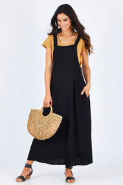 Model Gemma wearing size 10 of the Flow With Me Slouch Dress in colour Black (Black), from the front, showing the whole outfit