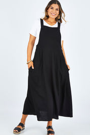 Model Palatina wearing size 14 of the Flow With Me Slouch Dress in colour Black (Black), from the front, showing the whole outfit