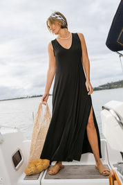 Model Tegan wearing size 10 of the My Faithful Maxi Singlet Dress in colour Black (Black), from the front, showing the whole outfit