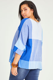 Model Terri-Leigh wearing size 14 of the Joy And Laughter Slouch Top in colour Blues (Blue), from the back