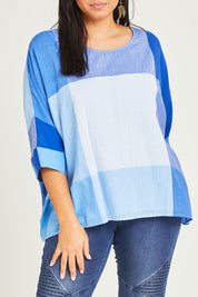 Model Terri-Leigh wearing size 14 of the Joy And Laughter Slouch Top in colour Blues (Blue), from the front, cropped image