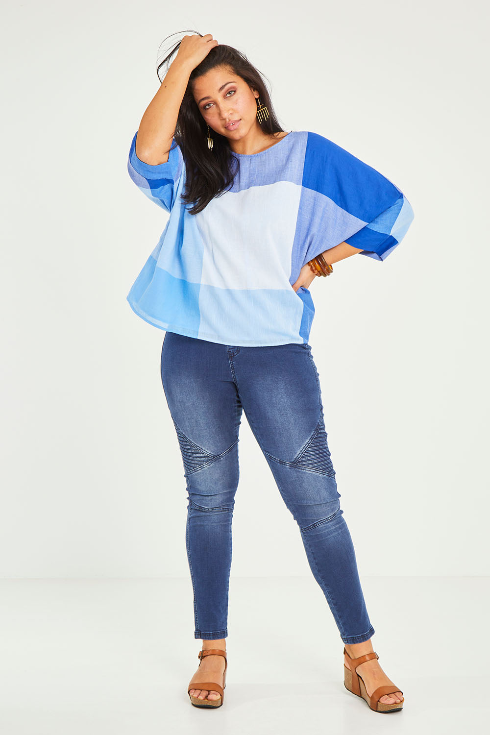 Model Terri-Leigh wearing size 14 of the Joy And Laughter Slouch Top in colour Blues (Blue), from the front, showing the whole outfit