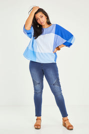 Model Terri-Leigh wearing size 14 of the Joy And Laughter Slouch Top in colour Blues (Blue), from the front, showing the whole outfit