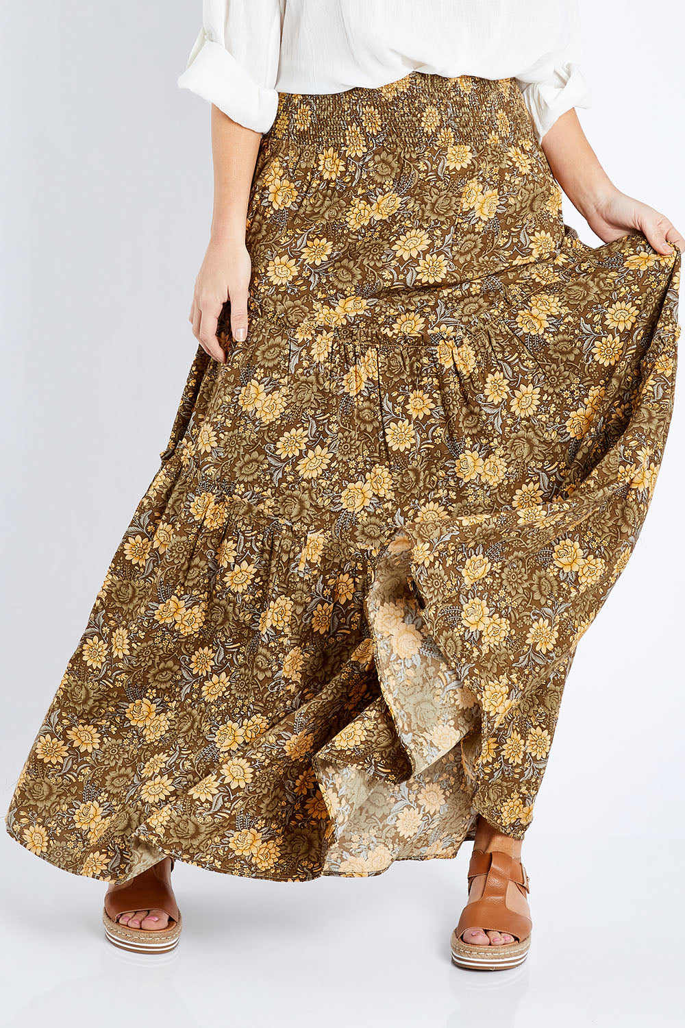 Model Laura wearing size 14 of the Skirting Around The Garden Skirt in colour Khakigold (Green), from the front, cropped image