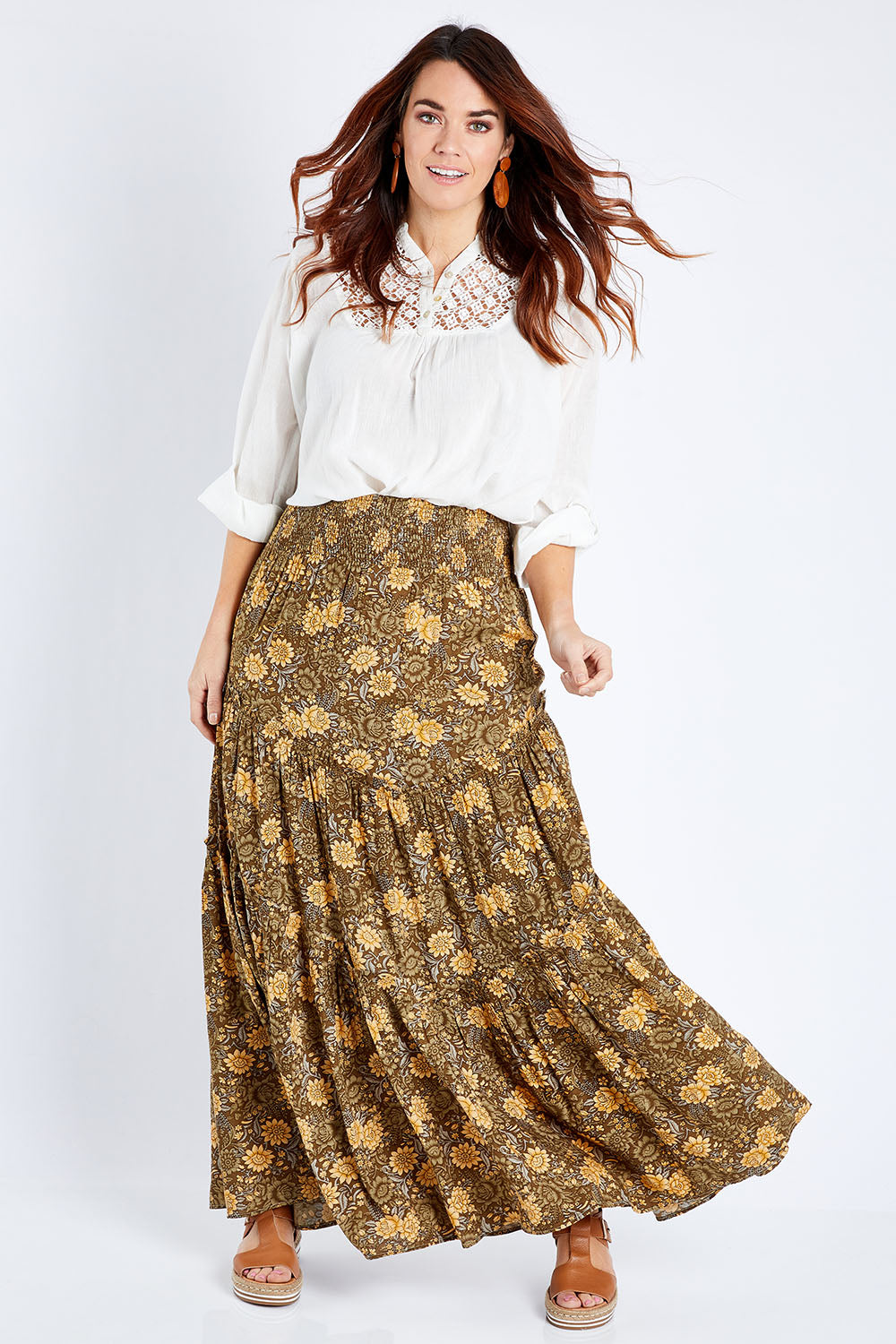 Model Laura wearing size 14 of the Skirting Around The Garden Skirt in colour Khakigold (Green), from the front, showing the whole outfit