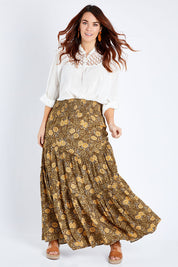 Model Laura wearing size 14 of the Skirting Around The Garden Skirt in colour Khakigold (Green), from the front, showing the whole outfit