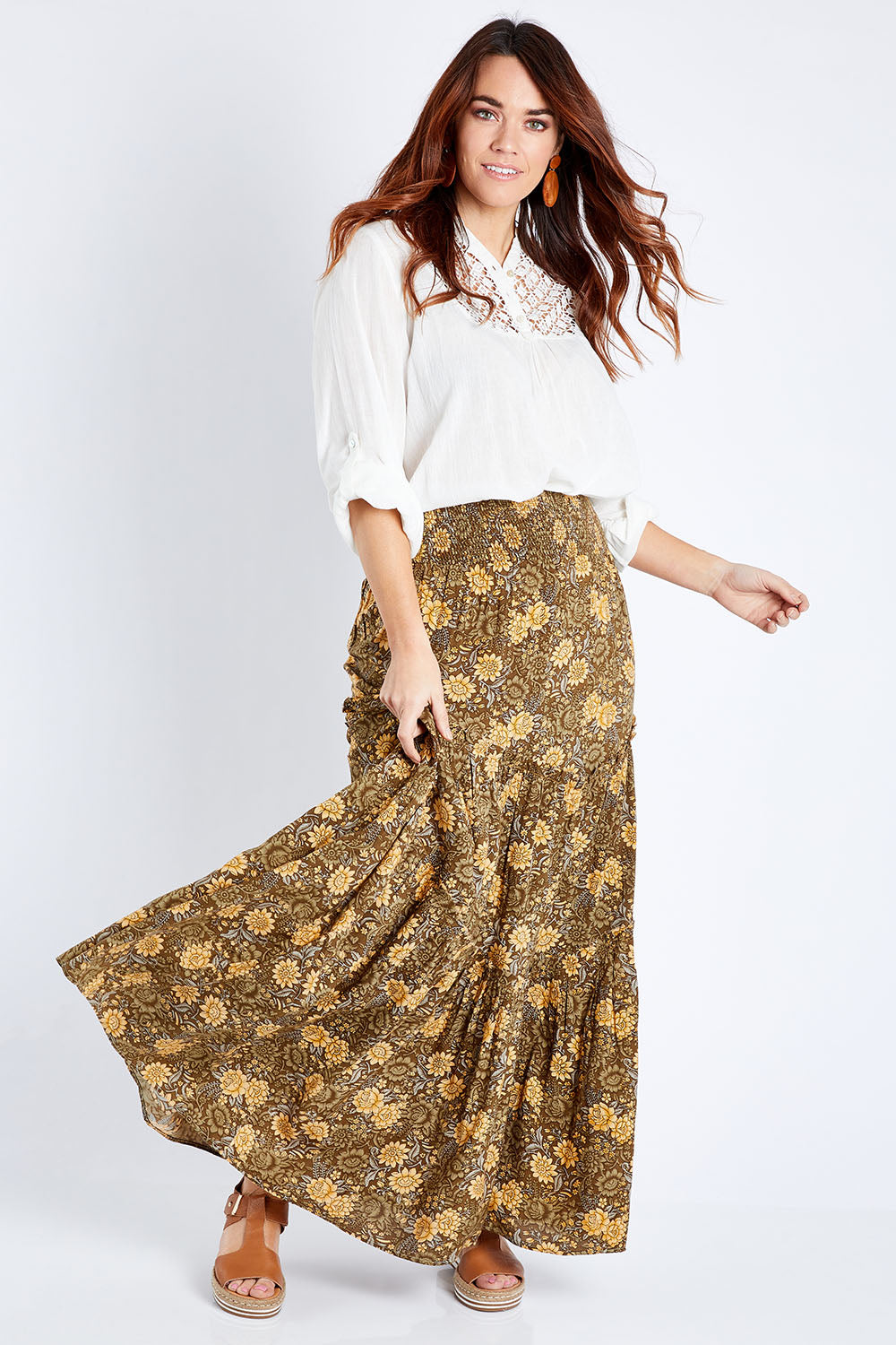 Model Laura wearing size 14 of the Skirting Around The Garden Skirt in colour Khakigold (Green), from the front, showing the whole outfit