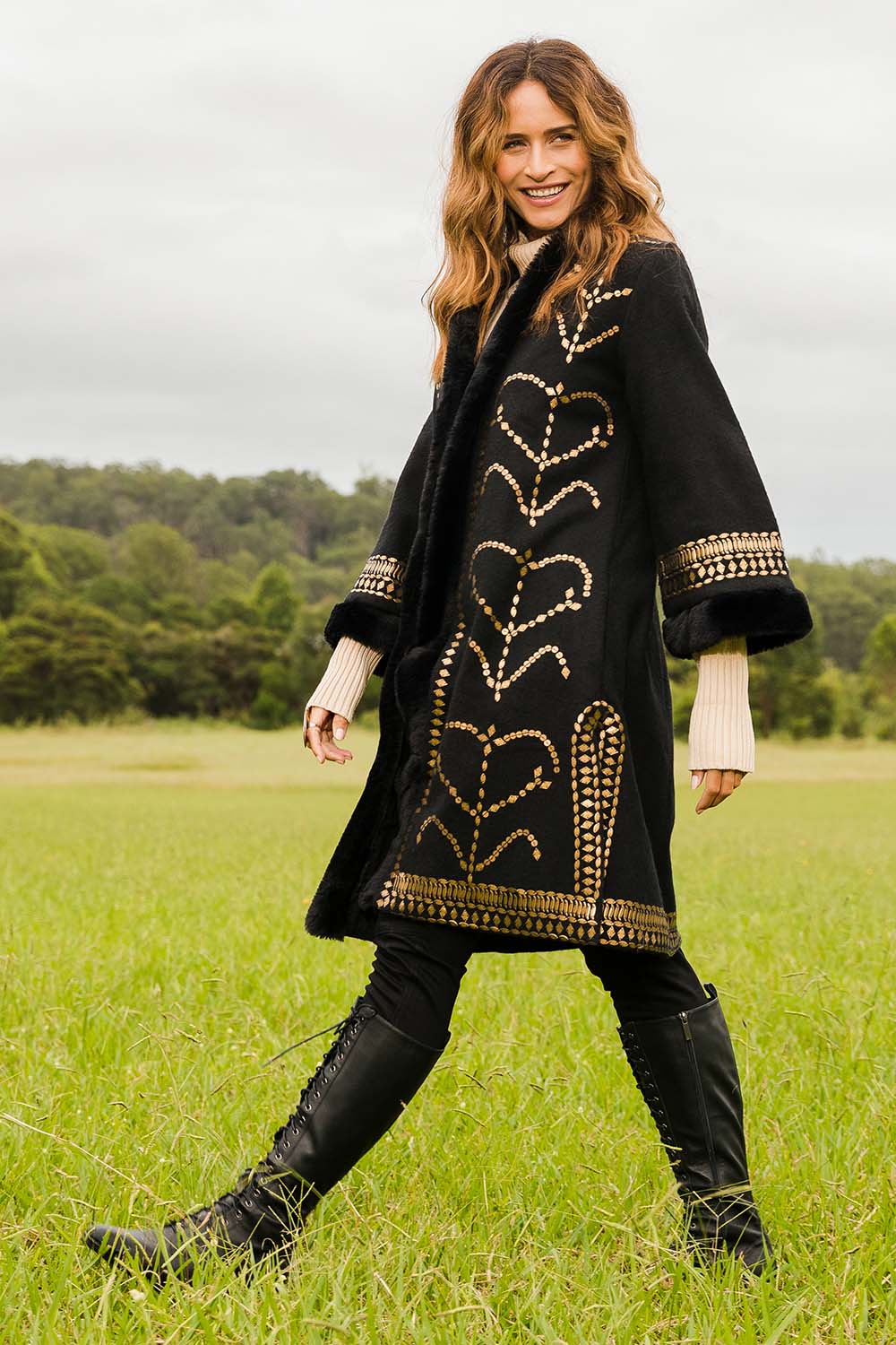 Model Ilona wearing size 10 of the Warm My Heart Applique Jacket in colour Black (Black), from the front, showing the whole outfit