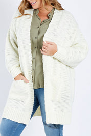 Model Fiona wearing size XL of the Mountain Dreaming Cardi in colour Cream (White), from the front, cropped image