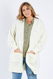 Model Fiona wearing size XL of the Mountain Dreaming Cardi in colour Cream (White), from the front, cropped image