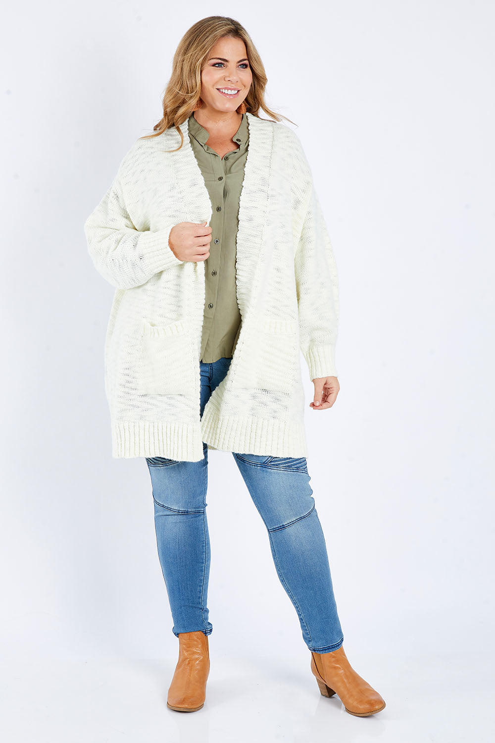 Model Fiona wearing size XL of the Mountain Dreaming Cardi in colour Cream (White), from the front, showing the whole outfit