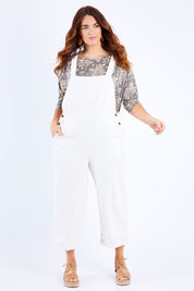 Model Laura wearing size 14 of the Ready For You Cord Overalls in colour Milk (White), from the front, showing the whole outfit