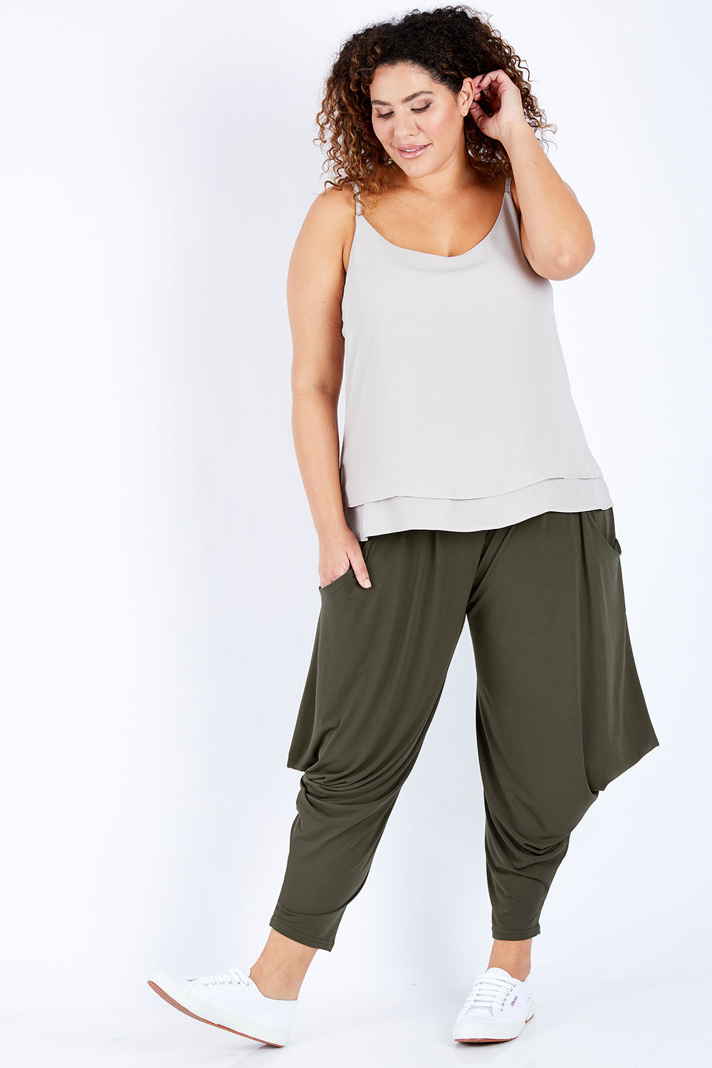 Model Jess wearing size 16 of The Wanderer In Me Travel Pant in colour Khaki (Green), from the front, showing the whole outfit