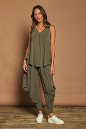 Model Madeline wearing size 10 of The Wanderer In Me Travel Pant in colour Khaki (Green), from the front, showing the whole outfit