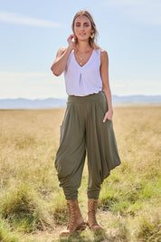Model Tegan wearing size 10 of The Wanderer In Me Travel Pant in colour Khaki (Green), from the front, showing the whole outfit