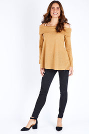 Model Ilona wearing size 10 of the Shine Bright Off The Shoulder Top in colour Gold (Metallics), from the front, showing the whole outfit