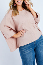 Model Jess wearing size 14 of the Flow With Me Cotton Slouch Top in colour Petal (Pink), from the front, cropped image