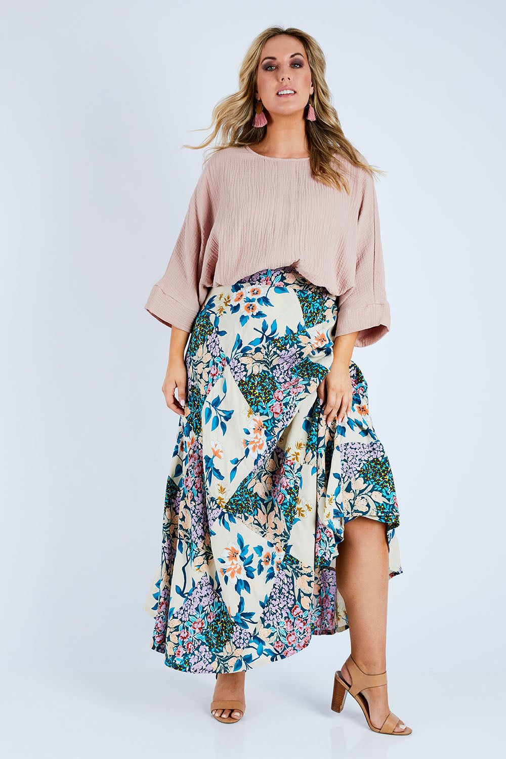 Model Jess wearing size 14 of the Flow With Me Cotton Slouch Top in colour Petal (Pink), from the front, showing the whole outfit