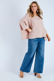 Model Jess wearing size 14 of the Flow With Me Cotton Slouch Top in colour Petal (Pink), from the front, showing the whole outfit