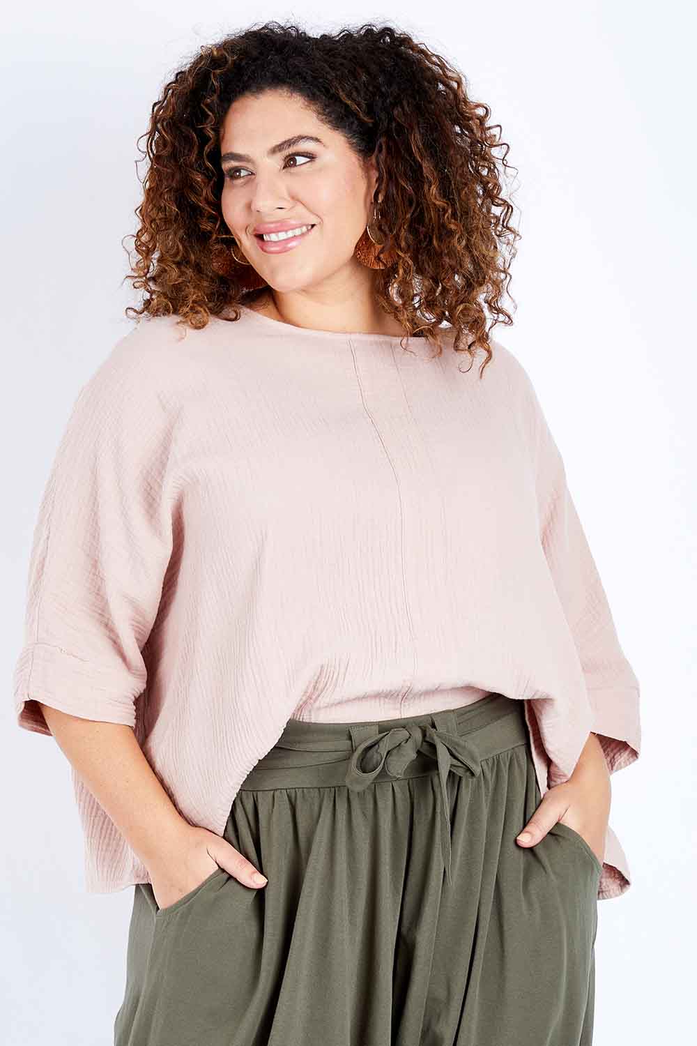 Model Jess wearing size 16 of the Flow With Me Cotton Slouch Top in colour Petal (Pink), from the front, cropped image