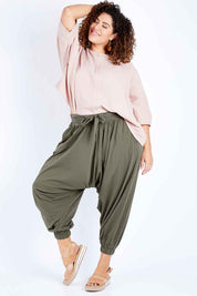 Model Jess wearing size 16 of the Flow With Me Cotton Slouch Top in colour Petal (Pink), from the front, showing the whole outfit