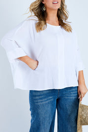 Model Jess wearing size 14 of the Flow With Me Cotton Slouch Top in colour White (White), from the front, cropped image