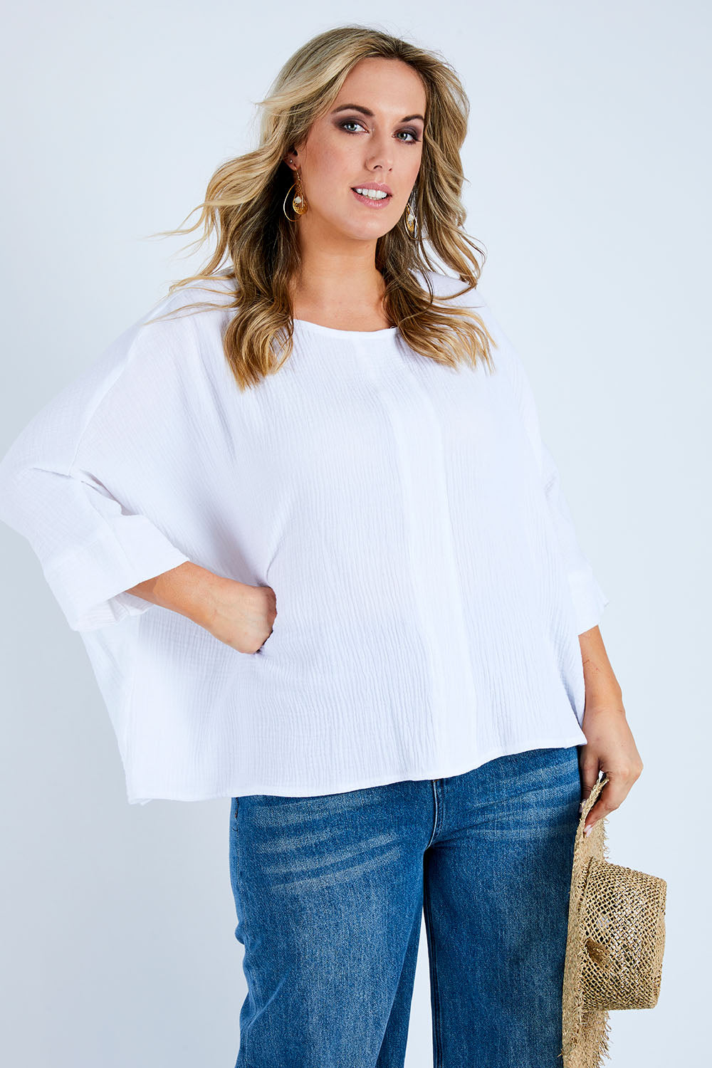 Model Jess wearing size 14 of the Flow With Me Cotton Slouch Top in colour White (White), from the front, cropped image