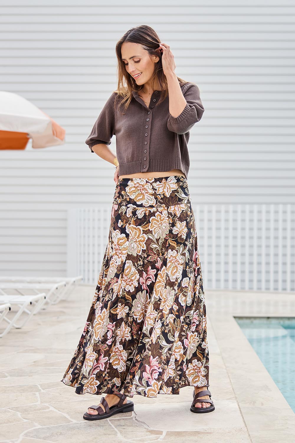 Model Tegand wearing size 10 of the The Wanderer In Me Printed Travel Skirt – Garden in colour Garden, from the front