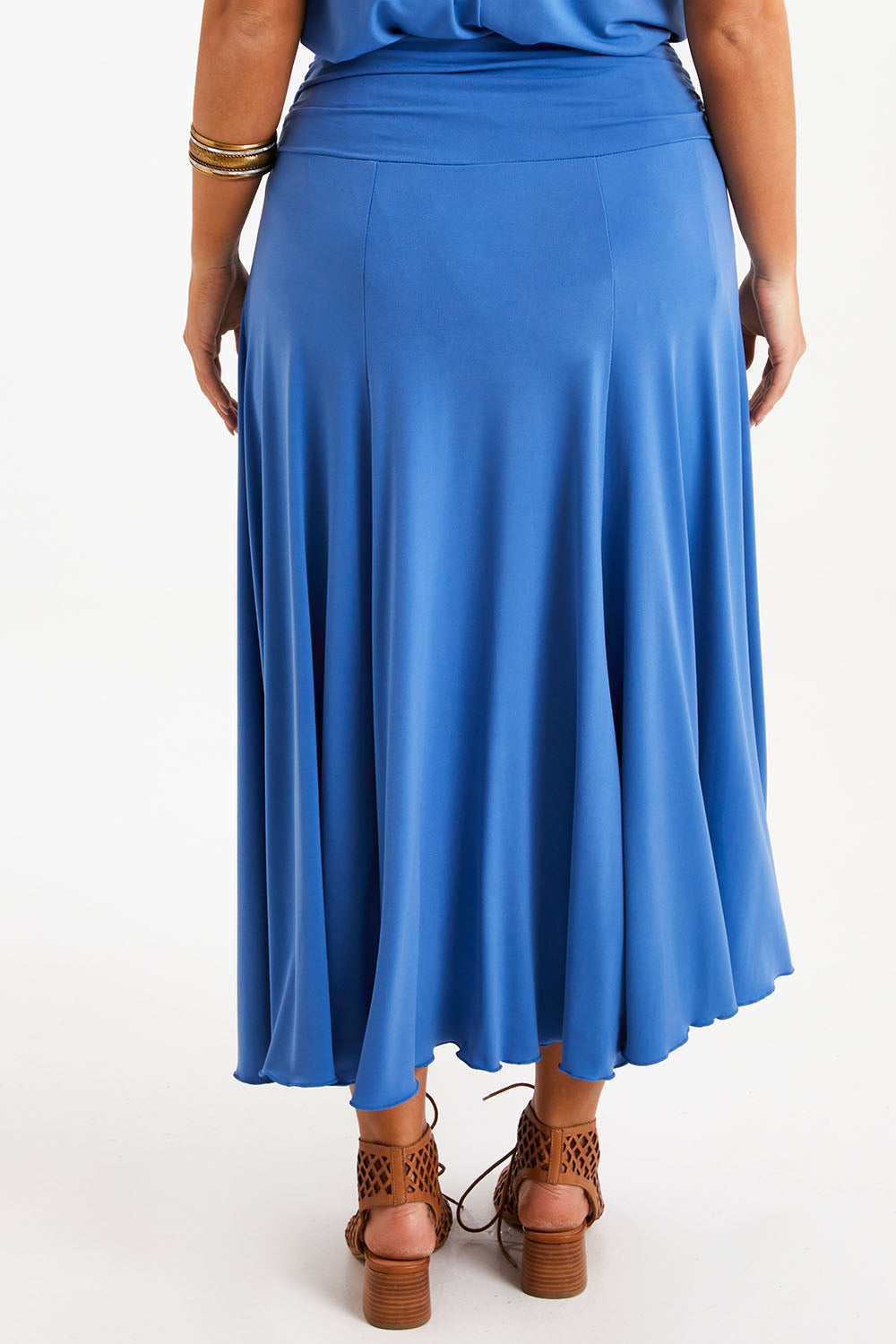 Model Monique wearing size 14 of The Wanderer In Me Travel Skirt in colour Denim (Blue), from the back
